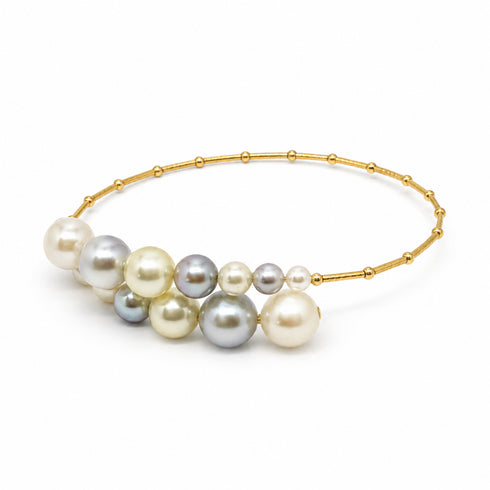 Bracelet Celestial Tide Japanese Akoya Pearl Bangle on 18K gold with multicolor pearl cluster centerpiece.