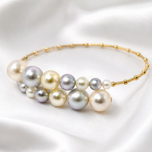 Bracelet: Celestial Tide Japanese Akoya Pearl Bangle in 18K Gold with multicolored Akoya pearls, House Of Pearls