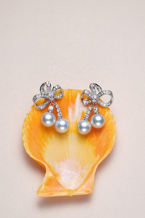 Earrings: 7–8mm Japanese silver-blue Akoya pearl celestial bow duo drop earrings by House Of Pearls XM
