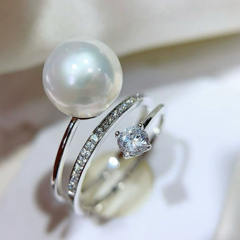 Two rings: 8-9mm Akoya pearl solitaire ring with a pave diamond band in silver-tone metal
