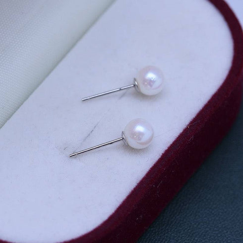 Pair of 6-7mm white pearl stud earrings with silver posts