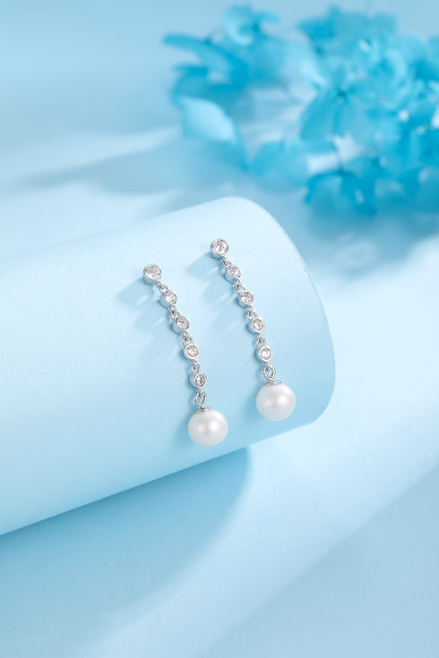 Pair of 6-7mm freshwater pearl long-drop cubic zirconia earrings; silver-tone chain with CZ links and dangling pearls