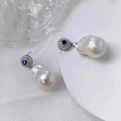 Pair of Sapphire White Freshwater Baroque Pearl Earrings with blue sapphire stud and pavé halo