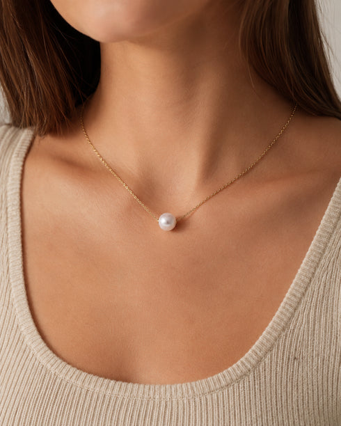 Floating pearl necklace with a 12-13mm freshwater pearl on a delicate gold chain