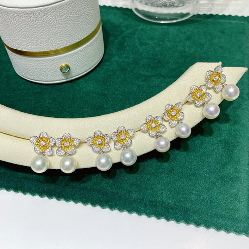 Flower freshwater pearl necklace with crystal-studded gold-tone flower motifs and pearl drops