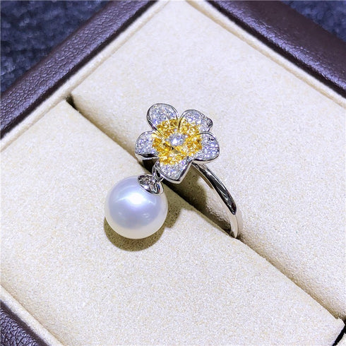 Flower freshwater pearl ring with diamond-accent petals and suspended pearl drop on silver-tone band