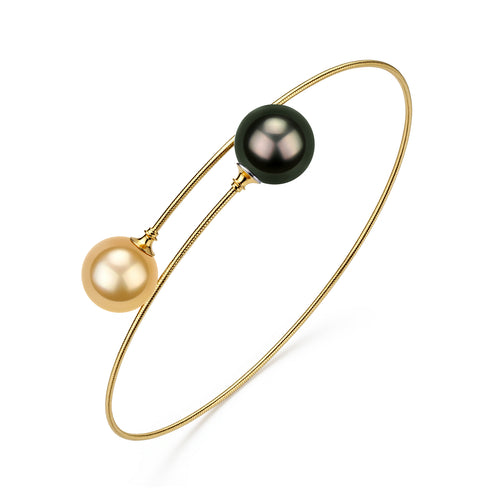 Tahitian Black Pearl Pendant Necklace with three colored pearls (peach, green, gold) on a gold snake chain against white background