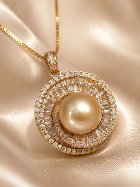 Gold necklace pendant with 10–11mm freshwater pearl surrounded by a double halo of zirconia.