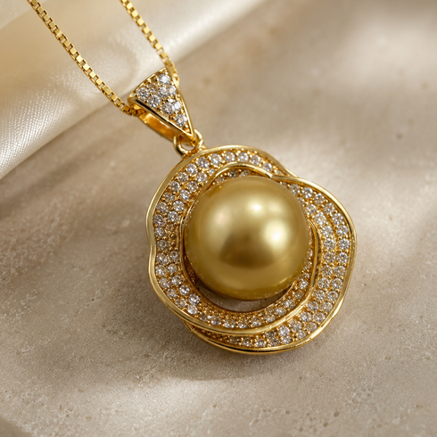 Pendant necklace featuring a 10–11mm South Sea golden pearl surrounded by a diamond halo in gold.