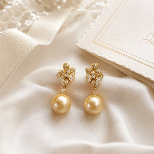 Earrings: Flora Bloom Golden South Sea Pearl Drop Earrings by House Of Pearls, gold-tone with pearl drops.