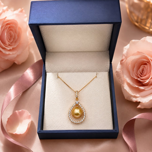 Necklace: 10-11mm golden South Sea pearl teardrop pendant with CZ halo on a gold chain, in a blue jewelry box
