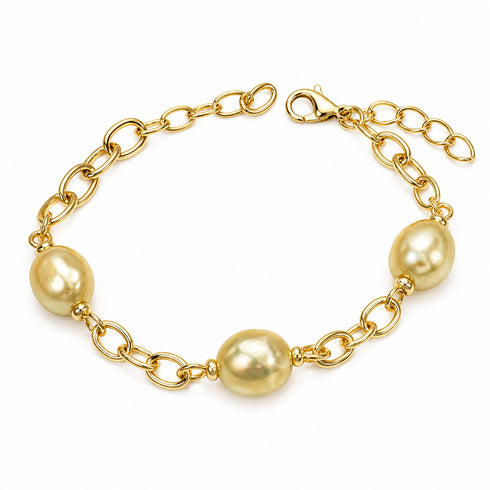 Necklace with gold-tone chunky-link chain and three golden South Sea baroque pearls.