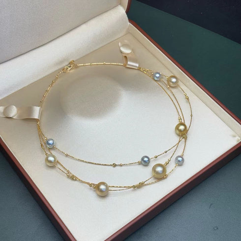 Golden South Sea and Akoya pearl necklace in 18K gold, double-strand with alternating pearls, in a jewelry box