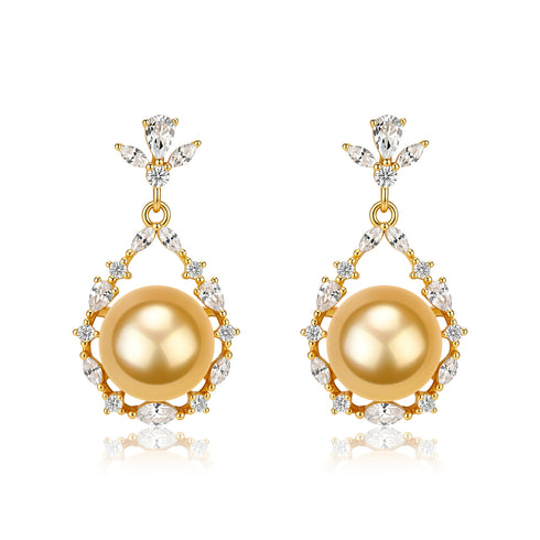 Earrings, gold-tone flora bloom drop with large golden South Sea pearl center surrounded by crystal accents; pair shown.