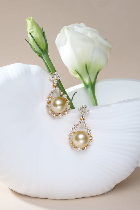 Earrings: House Of Pearls XM flora bloom drop with 10-11mm golden South Sea pearl and diamond halo
