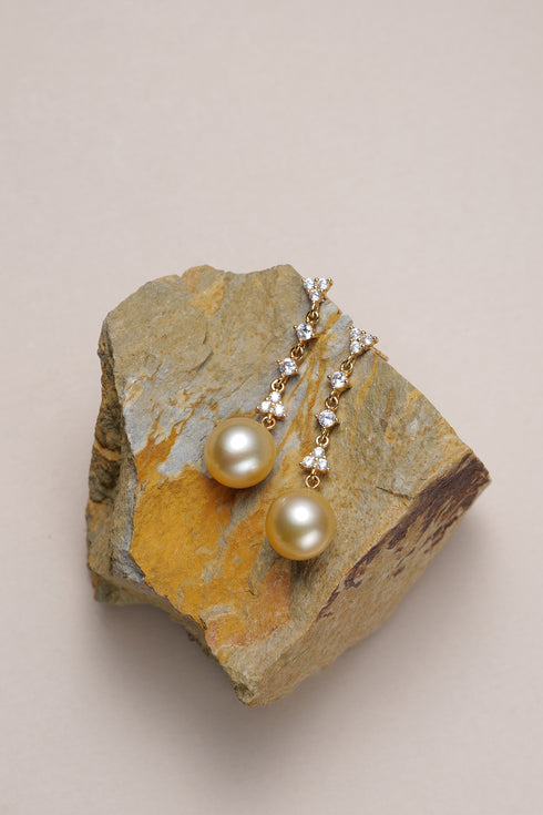 Earrings: 10–11mm Golden South Sea Pearl dainty gold drop earrings by House Of Pearls XM with crystal-accent chain