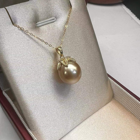Necklace: 12-13mm golden South Sea pearl pendant with diamond-accent leaf cap on a gold chain