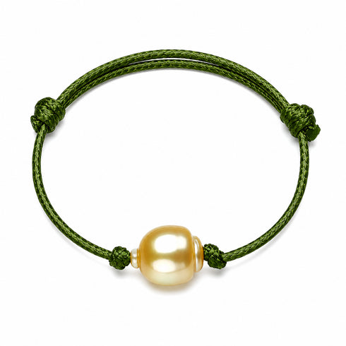 Bracelet, green braided leather with a golden South Sea baroque pearl centerpiece, knotted adjustable cord.