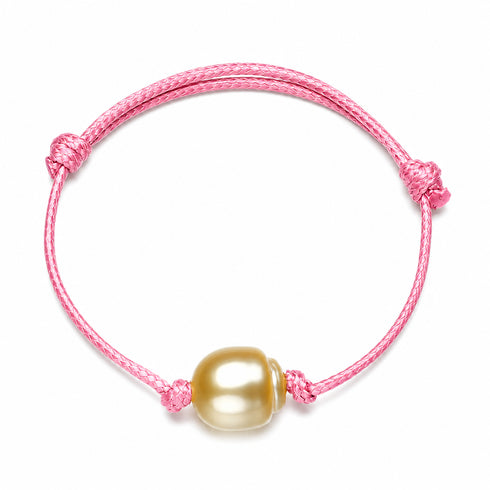 Bracelet: pink knotted adjustable cord with golden South Sea baroque pearl bead