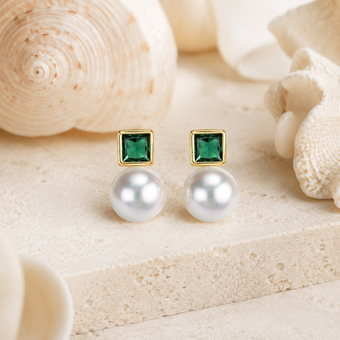 Sasha stud earrings pair with 7–8mm white Akoya pearls and green square zirconia in gold settings