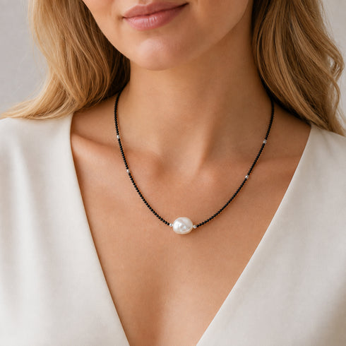 Black spinel beaded baroque pearl choker necklace with a central white baroque pearl