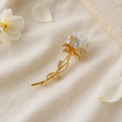 Rose Baroque Pearl Brooch, gold-tone with pavé crystals and a baroque pearl centerpiece