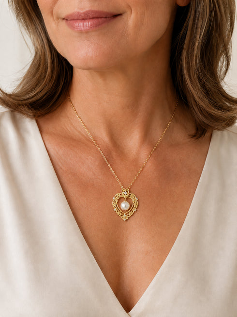 Vintage hollow heart pendant necklace with freshwater pearl on gold-tone chain