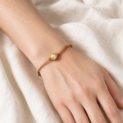 Golden South Sea Pearl Knotted Leather Bracelet on brown cord with a single pearl bead.
