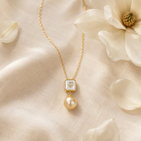 Necklace: 10-11mm South Sea golden pearl heart pendant with a mother-of-pearl square frame on a gold chain