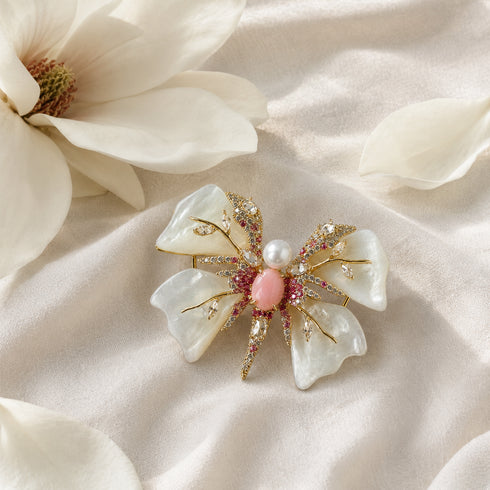 Butterfly brooch with pearl-white shell petals and crystal accents