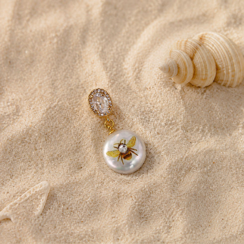 Pendant: Hand-painted bee and flower on baroque pearl, gold-tone clip with crystal halo