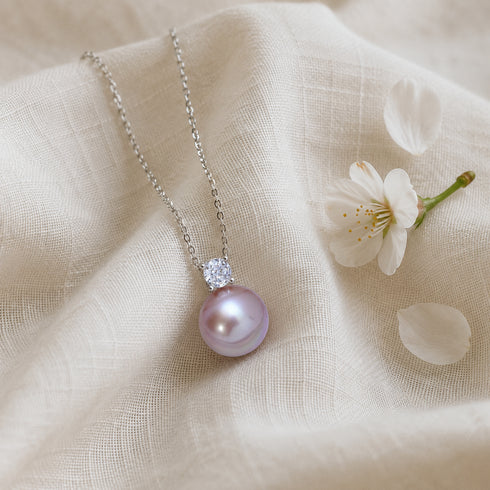 Necklace: 10-11mm freshwater pearl Sasha pendant with a crystal accent on a silver chain.