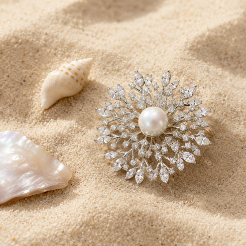 Snowflake brooch with a 10–11mm freshwater pearl center and crystal pave petals