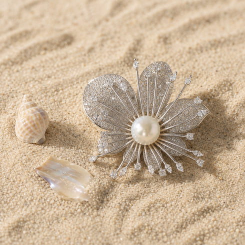Brooch: 10–11mm Freshwater Pearl Orchid by House Of Pearls - QD; silver pavé petals with a central pearl.