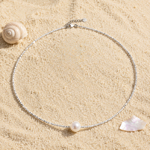 Necklace with white freshwater pearl pendant on a silver shard-bead chain