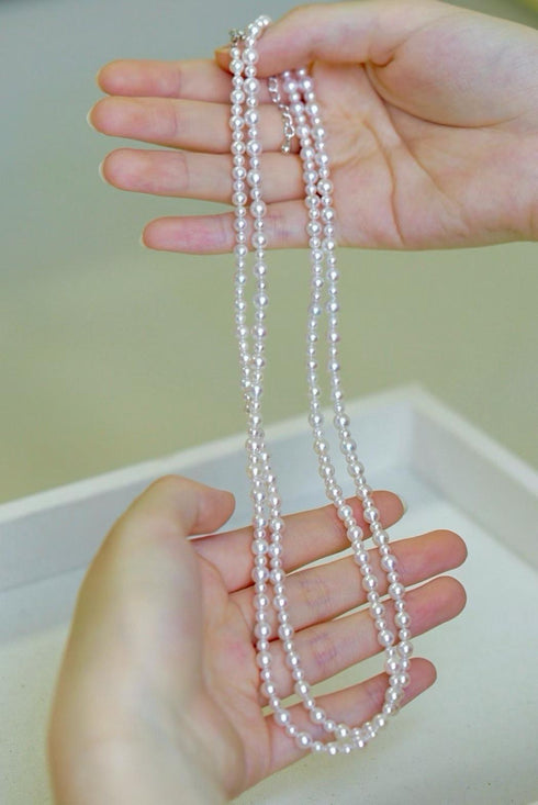 Pearl opera necklace with 3–5mm white Akoya seawater pearls.