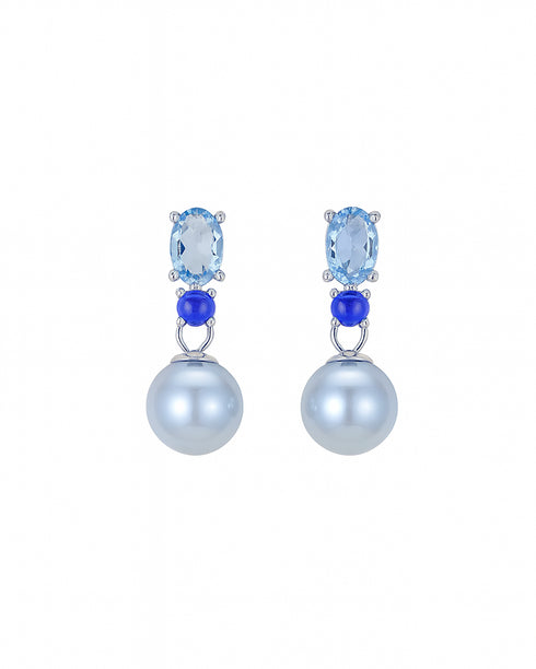 Pair of earrings with blue gemstones and pearl-like balls on a white background