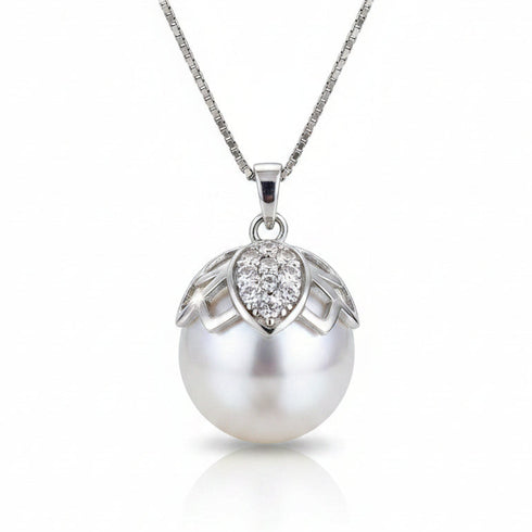 Necklace featuring white South Sea baroque pearl butterfly pendant with a diamond-accented cap on a gold-tone chain.