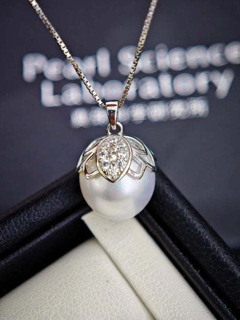 White South Sea baroque pearl butterfly pendant necklace with a diamond-accent cap on a gold chain