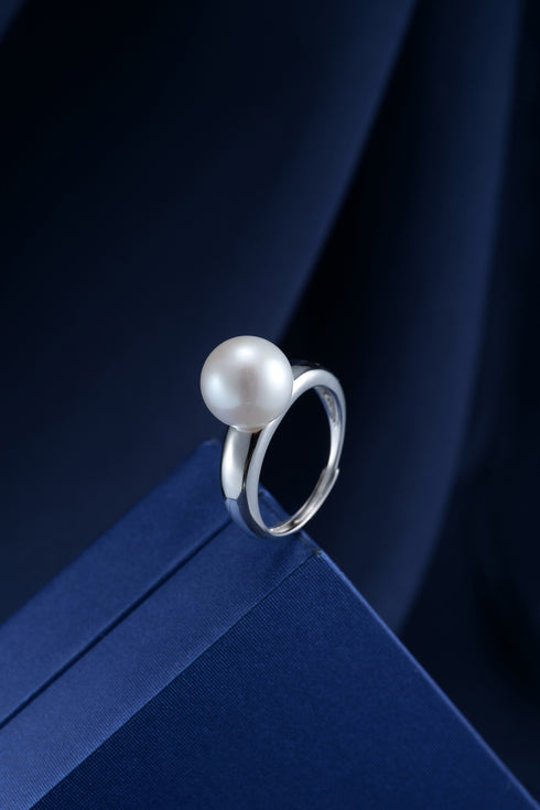 Pearl ring with a large white freshwater pearl on a silver open-band