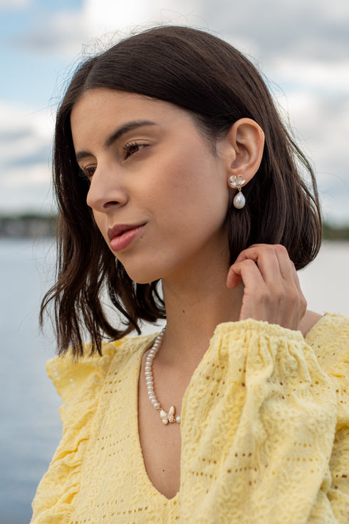 Magnolia enamel pearl drop earrings by House Of Pearls; gold-tone with white enamel flower and pearl drop.