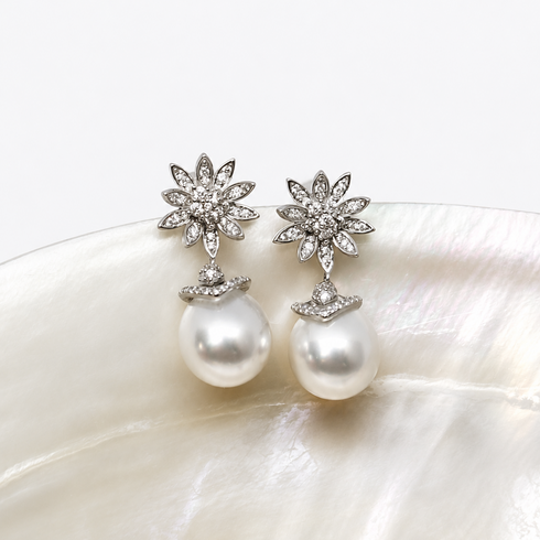 11-12mm White South Sea Pearl Flora Drop Earrings, a pair with diamond-studded flower tops