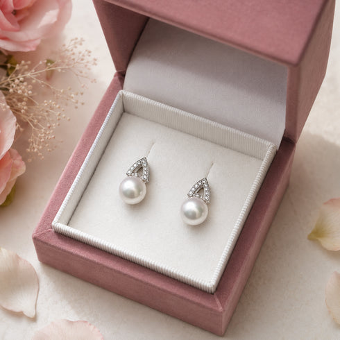 Earrings: House Of Pearls 8-9mm Japanese Akoya pearl stud earrings with pave detail in a pink jewelry box