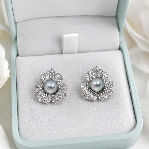 Earrings: 7-8mm Japanese Silver Blue Akoya floral stud by House of Pearls with pave diamonds around a blue-gray pearl.