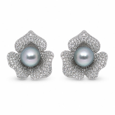Pair of flower-shaped stud earrings featuring silver pavé petals and blue Akoya pearls, House of Pearls