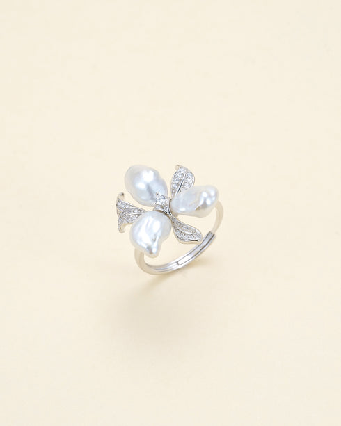 Ring with a silver band featuring a Keshi freshwater pearl flower with diamond-accented petals