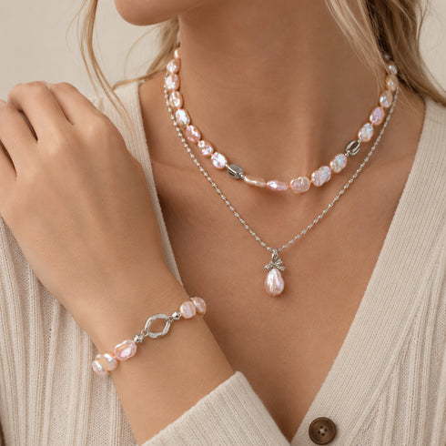 Keshi freshwater pearl petal 3-piece jewelry set in iridescent pink-purple; pearl choker, pendant necklace, and bracelet