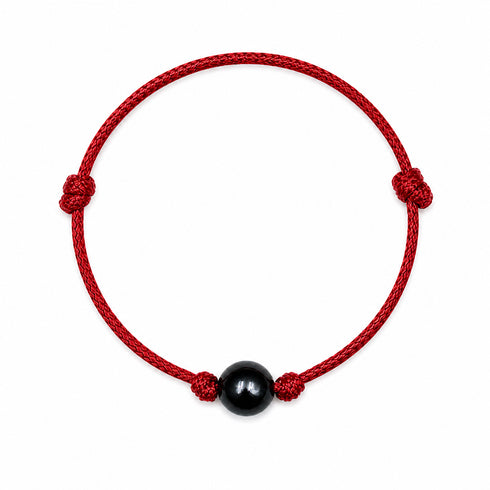 Bracelet: Tahitian Baroque Pearl Knotted Leather, red braided cord with a central black pearl; House of Pearls-TA.