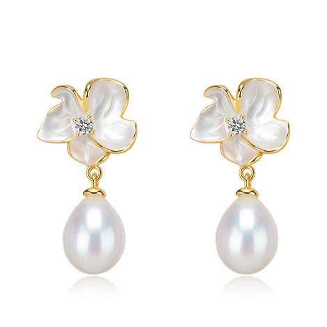 Magnolia enamel pearl drop earrings; gold-tone flower petals with a crystal center and dangling pearls