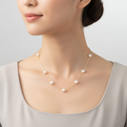 Tin Cup freshwater pearl necklace with seven white 7–8mm pearls on an 18K gold chain